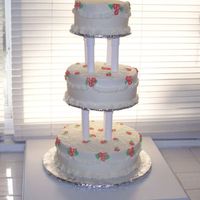 25Th Anniversary This was a replica of the couples original wedding cake 25 years ago, topper was at the party and placed there. White cake, royal flowers...