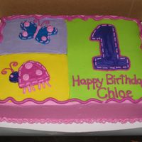 Hugs & Stitches 1St Birthday Half chocolate, half white, filled with buttercream, BCTs for decorations