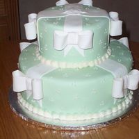 Green With Bows This is a findant covered cake accented with fondant/gumpaste bows.
