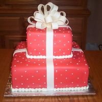 Red Boxes This fondant covered square tiered cake was made for a bridal shower. The bow is made from a fondant/gumpaste mix.