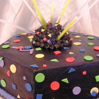 Laser Tag Party BC with fondant accents. Based on the venue's corporate logo. Topper is a half styro ball, BC, and glow sticks from the dollar store....