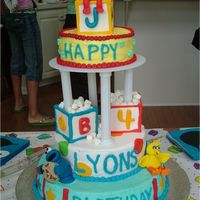John Lyons 1St Birthday Sesame Street Babies! Buttercream cakes with Fondant figures and accents. Blocks are made of Gumpaste. This was made for my little guy'...