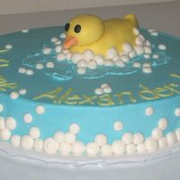 Rubber Duck Baby Shower I made this cake for a baby shower with a rubber duck theme; it is a 12 inch round Bride's White cake from the CMD. I made the duck...
