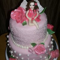 Fairy Rose Cake Cake made for 1 year old's fairy themed birthday party. All fondant, gumpaste roses...fairy made of fondant. Thanks for looking!