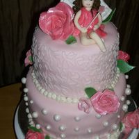 Fairy Cake Cake made for baby's first birthday. Fairy molded from fondant. Wings, roses, and leaves all made of gum paste. Thanks for looking!