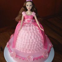 Pink Barbie Princess Cake Doll cake is strawberry cream with buttercream filling and base cake is vanilla with buttercream filling. Both are covered in MMF with MMF...