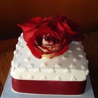 First Anniversary Cake Carrot cake with cream cheese filling. Iced in cream cheese frosting. Roses and ribbon are real.