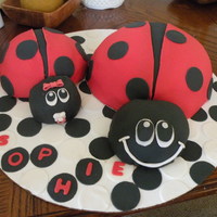 Ladybug Mommy And Baby This was for a baby shower (baby was to be called Sophie). Made mommy and baby (with pacifier and bow). All decorations made with fondant...