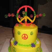 Peace 8 inch and 6 inch all buttercream with white chocolate peace signs and fondant flowers. tfl