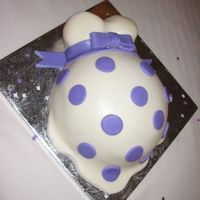 Pregnant Cake Marshmallow fondant with purple polka dots and bow.