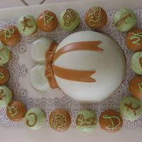Pregnant Safari Baby Shower Cake Marshmallow fondant for pregnant parts, buttercream icing for cupcakes.