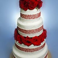 Roses Are Red A buttercream cake with red cornelli lace and fresh red roses.