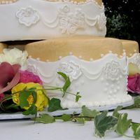 Detail Picture Buttercream, fondant, fresh flowers and royal icing detailing.