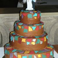 Mosaic Cake Chocolate buttercream with fondant mosaic pieces. The topper is a 3D photo of the bride and groom.