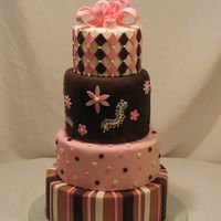 Pink And Brown A combination of fondant and buttercream make this modern and sassy wedding cake.