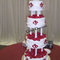 Kristi's Cake 12x10x8x6. Butter cream with red colorflow hearts.