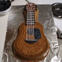 Guitar First cake with character pan. French vanilla cake with crusting cream cheese frosting (thanks CCBB).