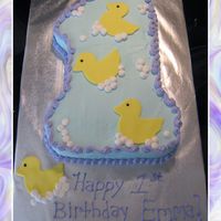 First Birthday Ducks Number one cake with bc icing and fondant ducks.