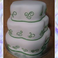 Petal Wedding Cake With Green Detail Customer wanted a petal cake and shipped her pans. Nice and simple, topper added at the restaraunt that cake was dropped off at.
