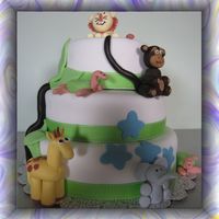 Jungle Safari Cake This was done for a first birthday. Fondant covered with fondant/gumpaste animals.