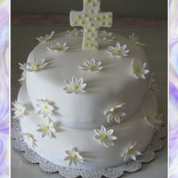 Baptisim Cake With Daisies Fondant covered with gumpaste flowers and cross. Made this one for my third daughters baptisim.