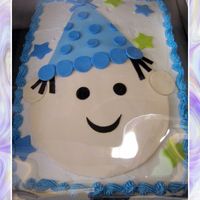 Little Boy With Birthday Hat 1/2 sheet iced with bc and done with fondant accents. Made to match plates and napkins for party.