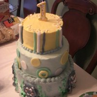 Tiered Hippo Cake Butter cake with pastry cream and buttercream with fondant accents. Those are hippos on the bottom in case you can't tell!