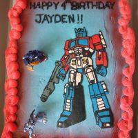 Transformer My sister in law's cousin asked me to make a cupcake cake with Optimus Prime. So here it is 35 chocolate and vanilla cupcakes covered...