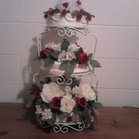 Anniversay Cake White cake filled with a chocolate mouse filling covered with buttercream frosting. The flowers are not real because I did not have time to...