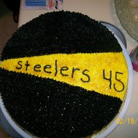 Steelers Cake This cake was so much fun. It is white cake with buttercream frosting. I used some edible confetti to add sparkle to it.