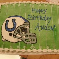 Go Colts Sheet cake with colts helmet.
