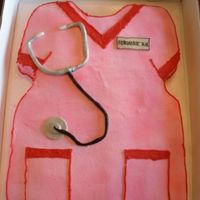 Nurse Cake Sheet cake carved to look like a shirt with fondant accesories.