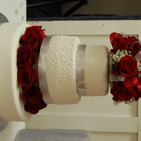 Rose Wedding Fresh red roses on fondant covered cake.