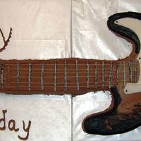 Guitar Birthday Cake This is a full sized copy of my son's electric guitar. Buttercream frosting with fondant strike plate and fondant covered Rolos for...