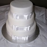 White Wedding This cake was to have fresh flowers added to the top. I don't know whether the florist madeit with the flowers or not. I haven't...