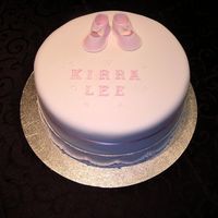 Kirra Lee This was a chocolate mud cake, the customer want it to be 'simple and sweet' with just the booties on the top with the name. I...