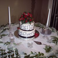 Scrolls WASC cake with cherry cream filling and Sugarshack buttercream (that stuff is amazing to work with). Black scrolls in royal icing. Black...