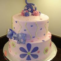 Pink And Purple Made for my daughter's fifth birthday. I used Sugarshack's buttercream and all the decorations are fondant and/or gumpaste. The...