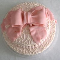 Valentines Wedding This 2-tier cake for a Valentines Day Wedding was iced in light pink buttercream, and then accented with ivory buttercream hearts. A pink...