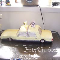 Dan's 16Th First attempt at 'carving' a cake. Was trying to copy a 1989 Ford Crown Victoria that we just purchased for 16yr ds to drive.......