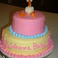 Stork all buttercream The stork is made out of chocolate clay. He was make last minute, I melted the first one i made.