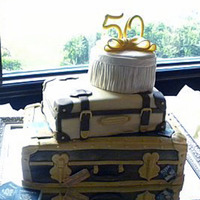50Th Anniversary Suitcase stack with steamer trunk with travel labels, old fashioned suitcase, and tufted hat box. Gumpaste "50". A really fun...