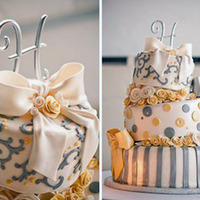 Topsy Turvy Wedding Cake In Buttery Yellow And Silvery Gray 7-10-13 rounds . Fondant roses with gumpaste/fondant bows. I used the triple leaf cutter for the scroll work on top. The silver strips,...