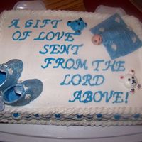 Babycake.jpg Vanilla cake with raspberry and bavarian filling, done all in buttercream, booties, blanket and baby done in fondant