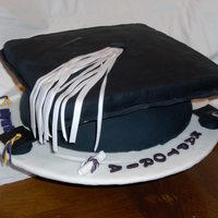 Graduation Hat Cake this was made for friends, who had a daughter,sister and son graduating.cake was made of fondant covering, everything is eatable.
