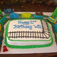 Train huge cake!! train tracks for train!! the train wrapped around the cake. it was too big and long to put ontop of the cake, so i thought...