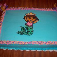 Dora Mermaid Dora Mermaid Sheet cake for my Goddaughter's birthday.. Dora was a frozen buttercream transfer.