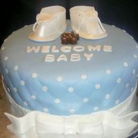 Baby Shower chocolate cake with cream cheese filling and fondant. Also with fondant booties.