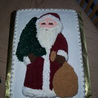 Old Country Santa This is a half sheet cake with a Wilton Old Country shaped pan on the top. This was a big hit at my husbands Christmas Party at work.