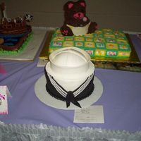 Navy Sailor I actually did this for a cake contest (local) and won 2nd place. The hat is a half ball. The brim if fondant. I had fun making it.